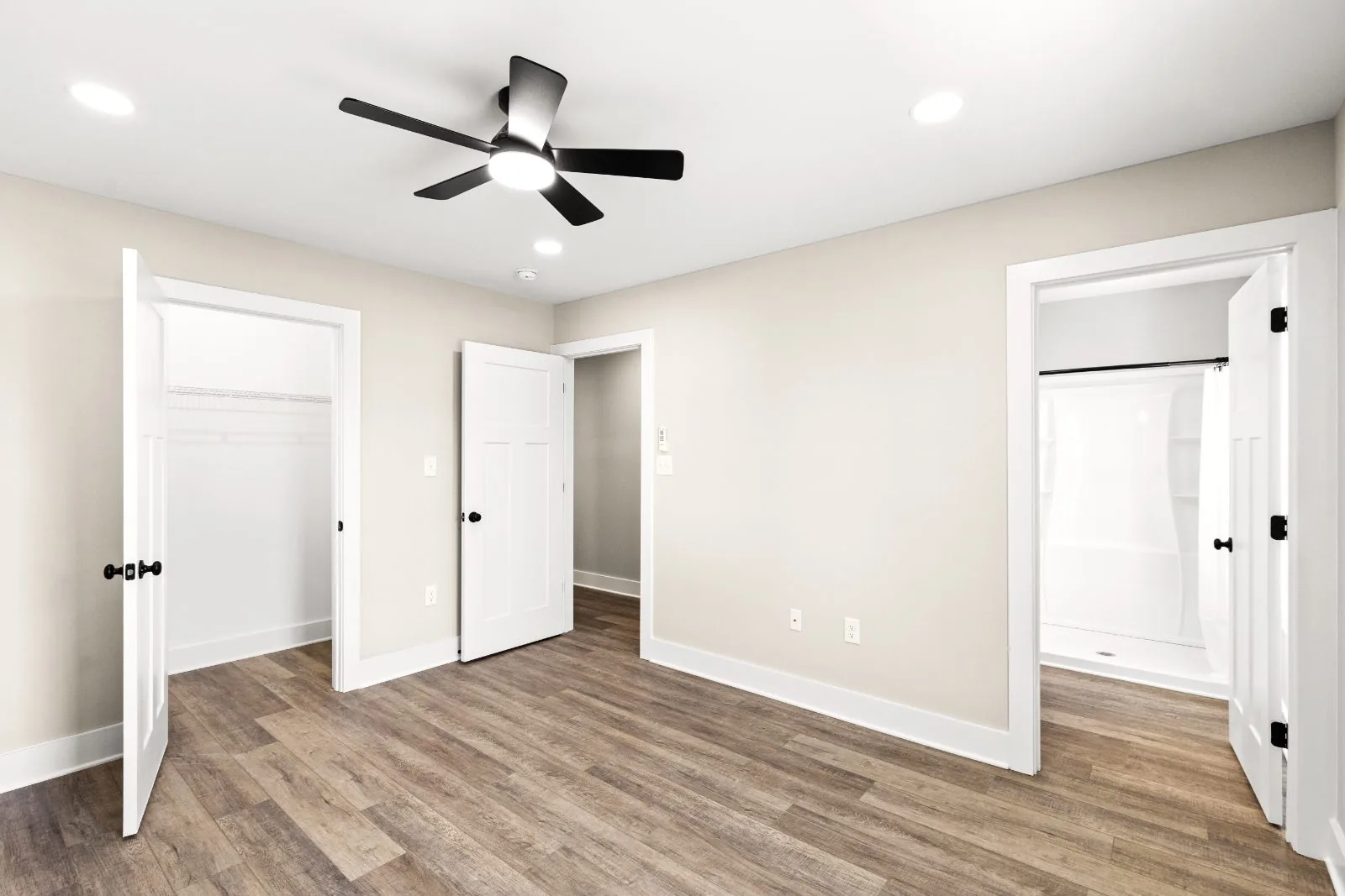 Bedroom with walk-in closet and adjacent full bath