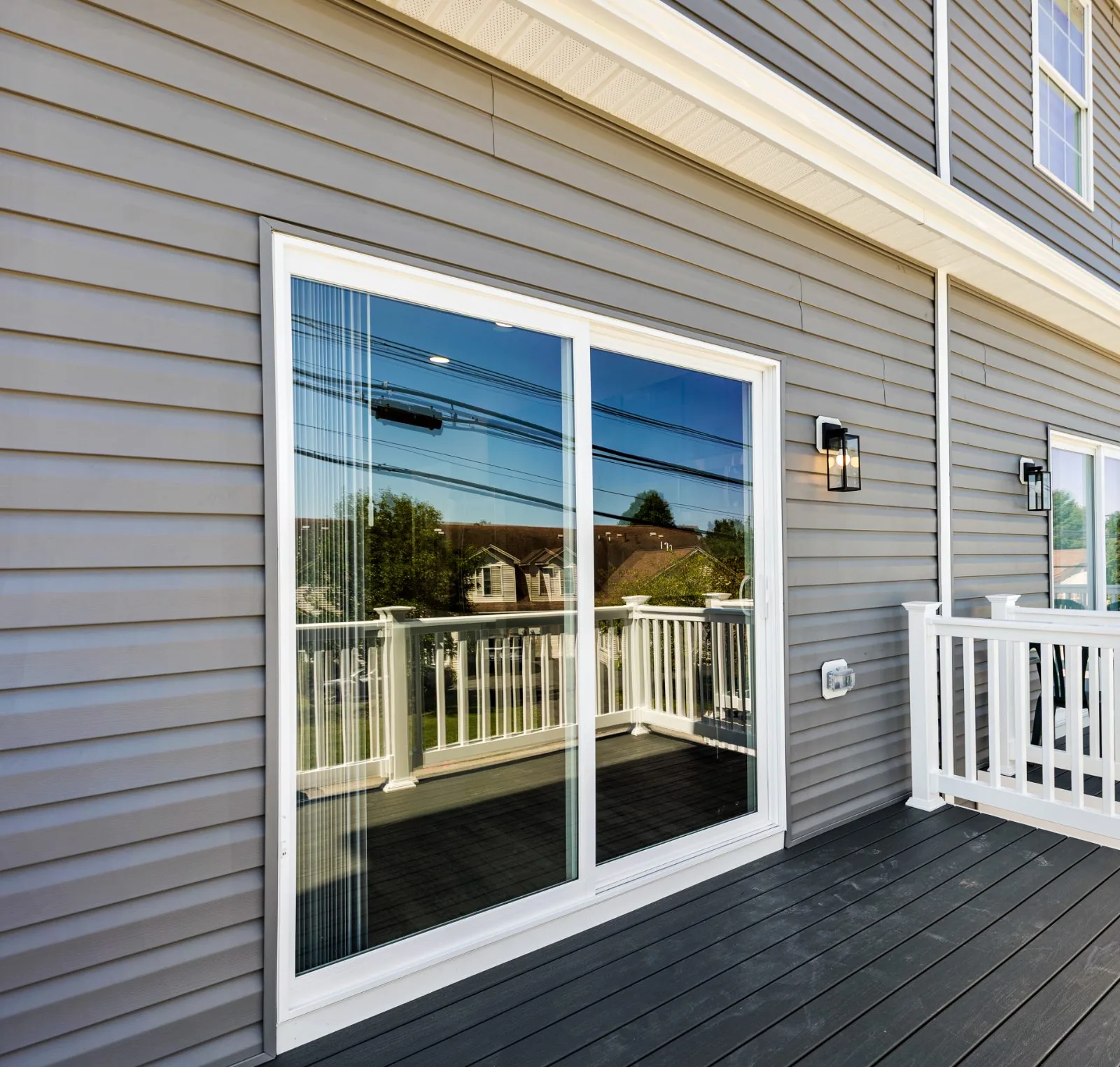 Composite deck with sliding door off the main level