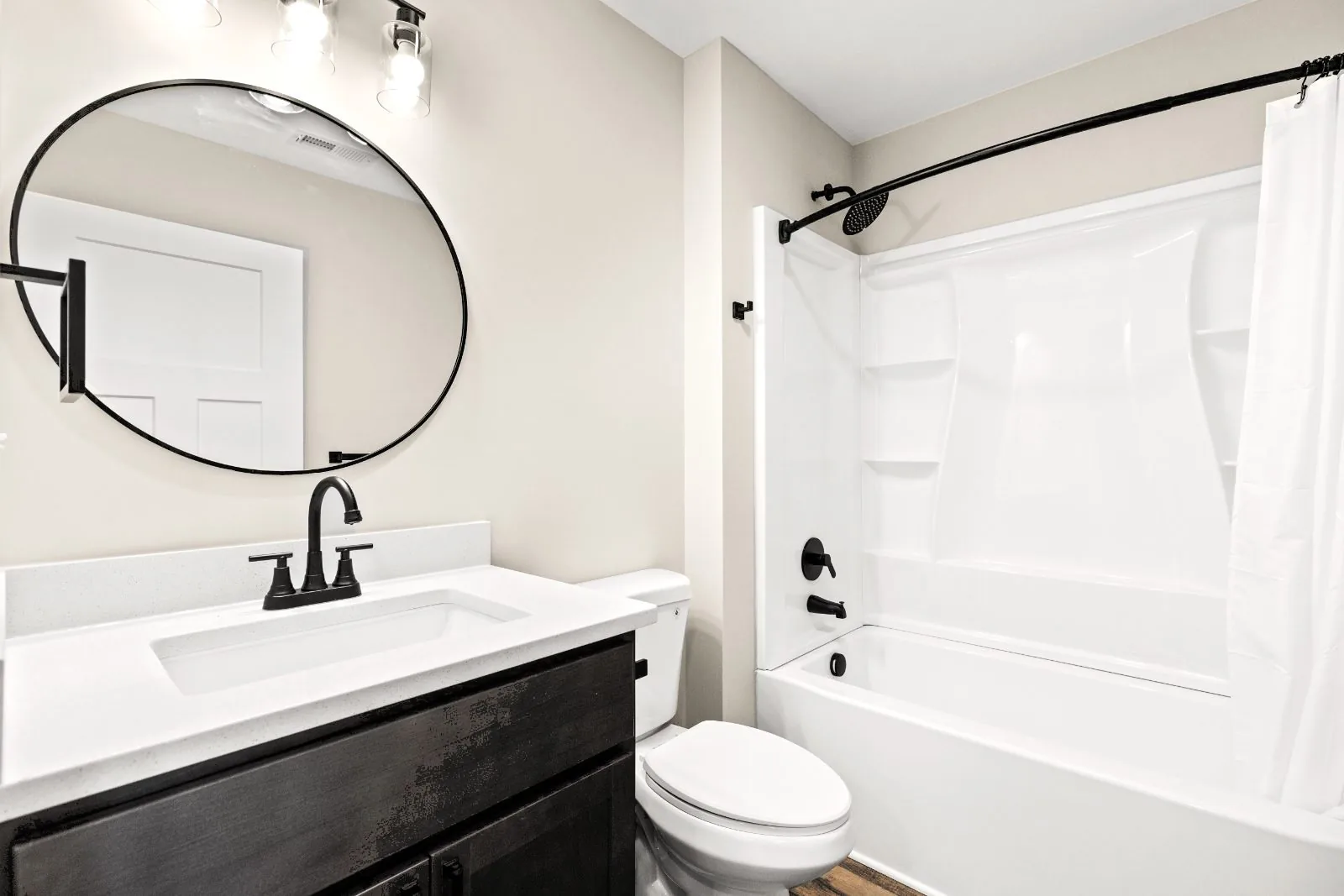 Full bath with quartz vanity and tub